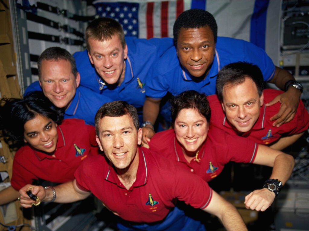 Space Shuttle Columbia Crewmembers Strike A Flying Pose